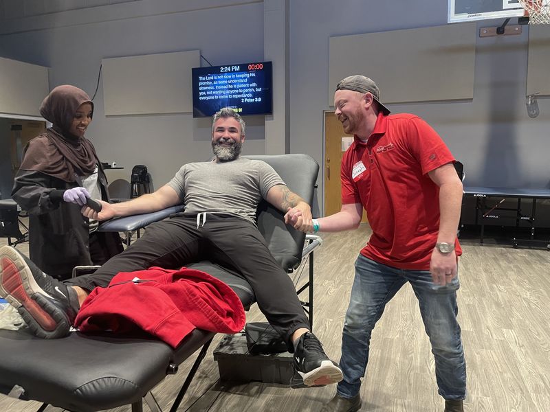 Joey and Zeke show support at the for each other and Roof Revivers at the 2025 Blood Drive.