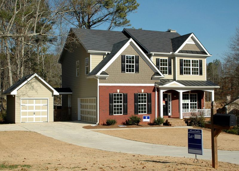 Professional siding contractor installing weather-resistant vinyl siding on residential home in Apex, North Carolina